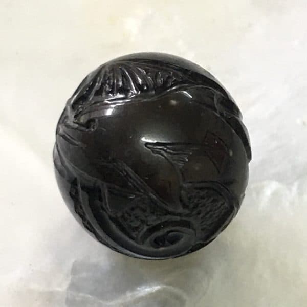 Carved Black Pearl with dolphin1 and Polynesian tattoo designs