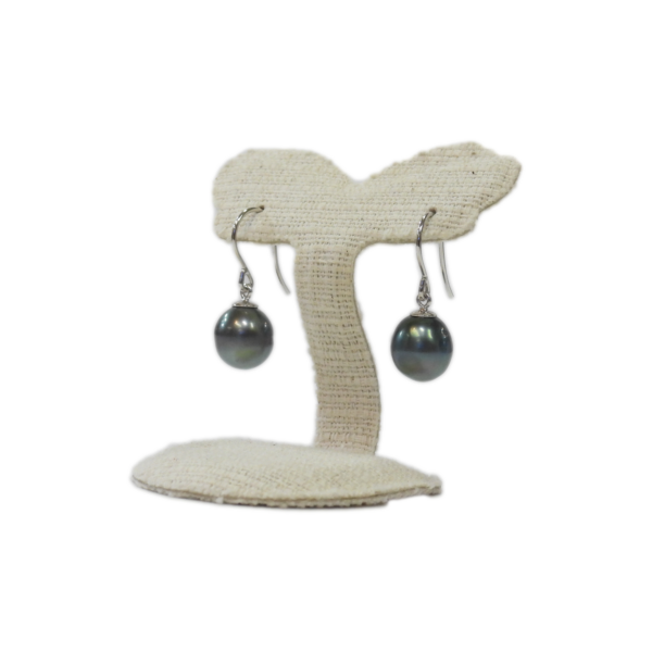 Genuine Tahitian black pearl earrings on a jewelry display stand, crafted by Island Craft Ltd. Since 1942.