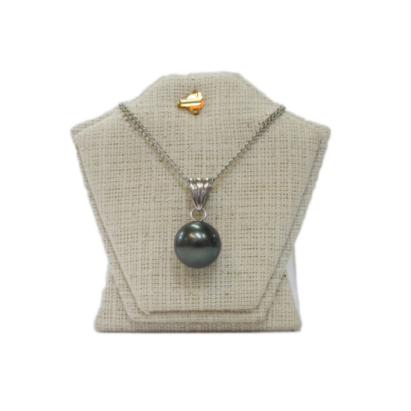 Shimmering black pearl pendant necklace on silver chain displayed on jewelry bust.